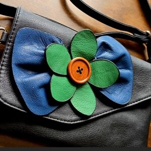 Black Leather Crossbody Bag with Blue Bow & Green Flower Accent